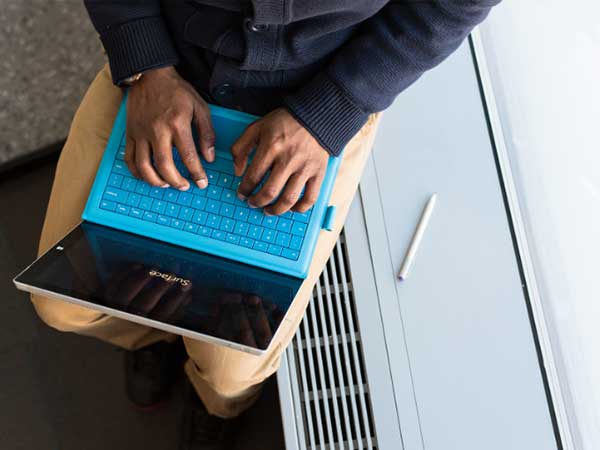 Aerial shot of typing on computer