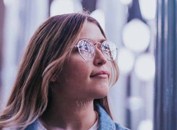 
						 Student looking towards light  - refelction in glasses.  
					