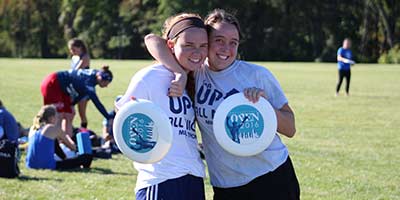 Two Girls playing Ultimate Frisbee 