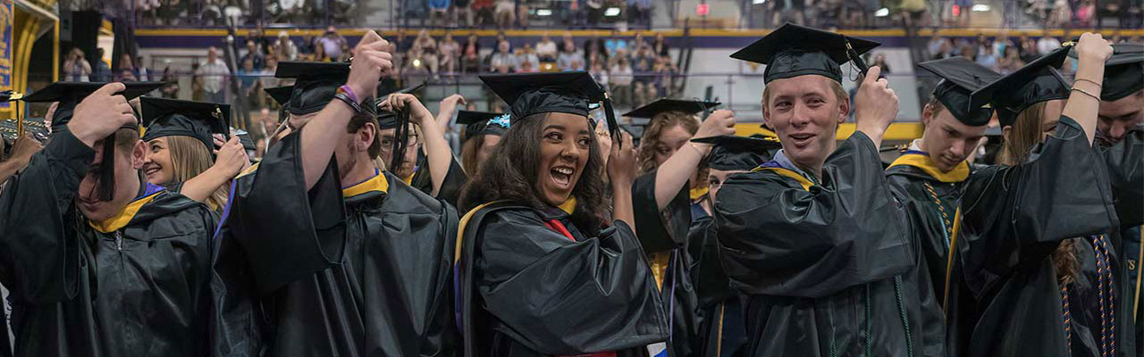 Students at Commencement moving their tassels