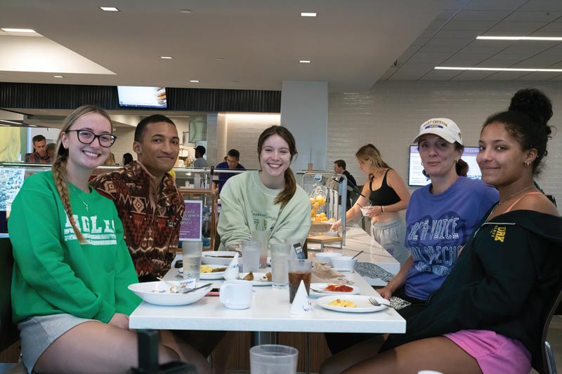 group of wcu students eating a meal in the dining hall