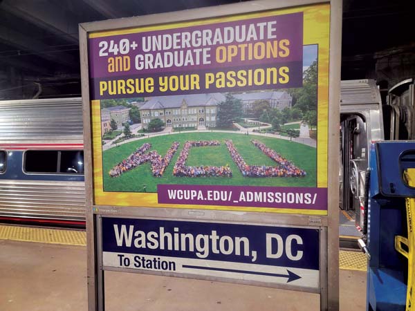 Graduate ads catch the attention of commuters in Union Station, Washington, D.C.