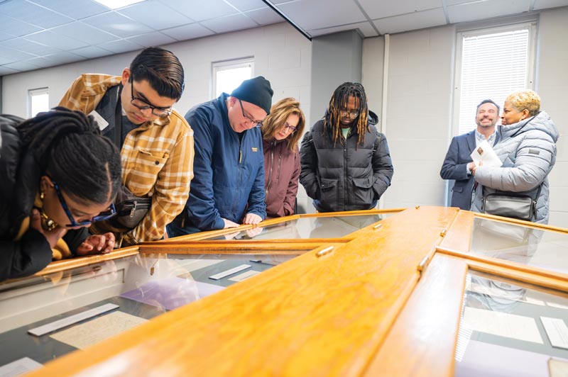 Students and guests at the Douglass celebration view archival materials in the library’s Special Collections.