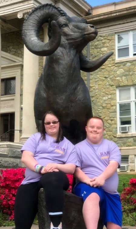 2 RAM Initiative students in front of the Ram Statue