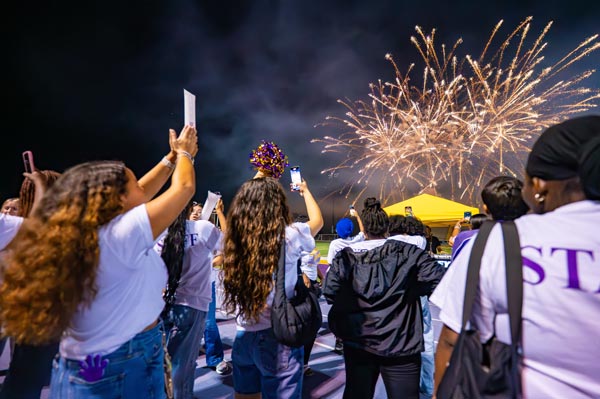 Students watching fireworks at Ram Rally