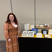 Student infront of table