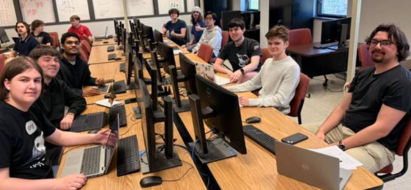 Students in front of computer monitors