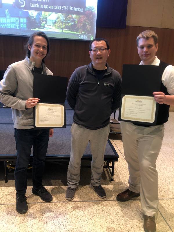 Scott and Eric with their awards, with Professor Chuan Li.