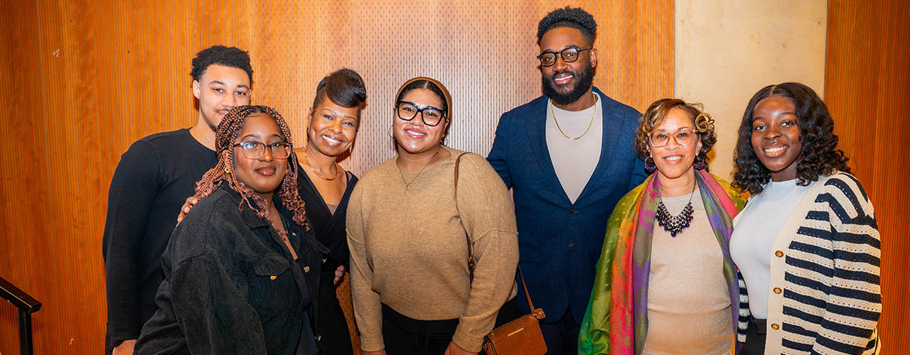 Group posing for photo at society event